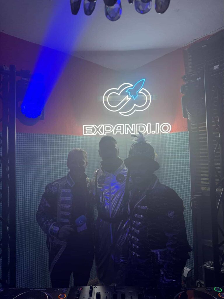 SaaS founders in costume inside the Expandi.io-sponsored Boiler Room DJ booth at a live SaaS event